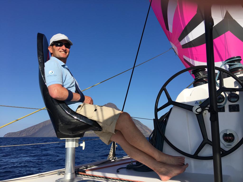 Stuart Austin, director of Promarine Finance, relaxing on a boat while smiling at the camera