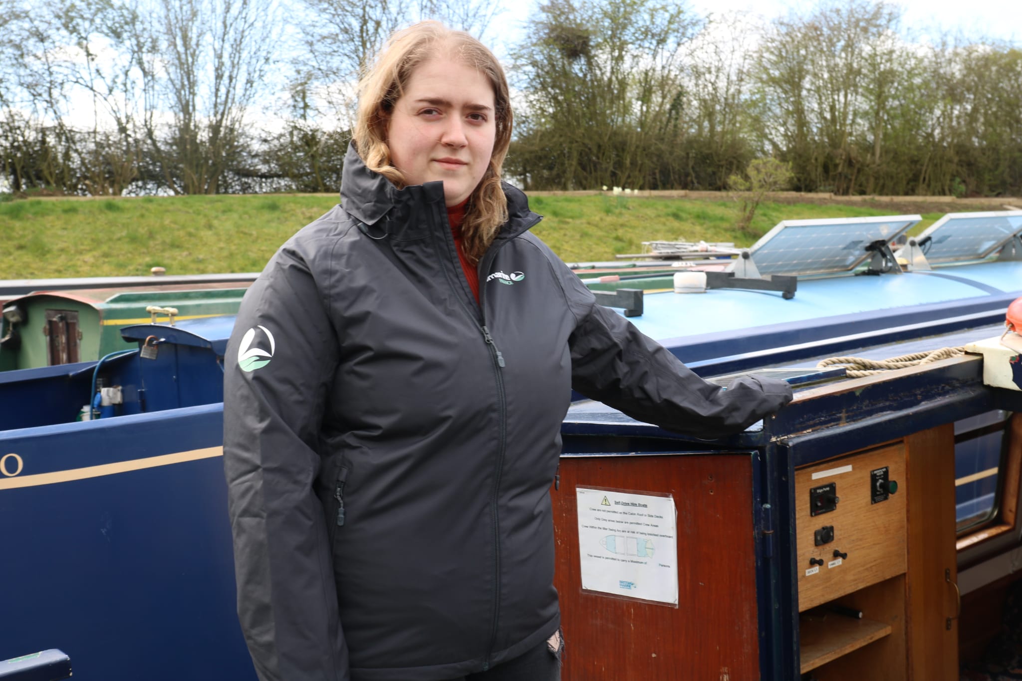 abigail ward stood in front of her new liveaboard boat